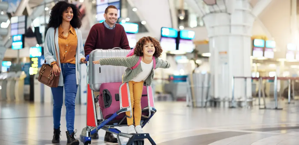 Immigrant family at U.S. airport after successful family-based immigration.