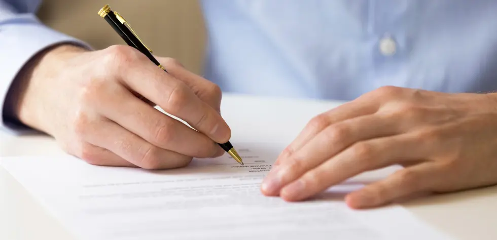 Investor completing EB-5 immigration documents for U.S. residency.